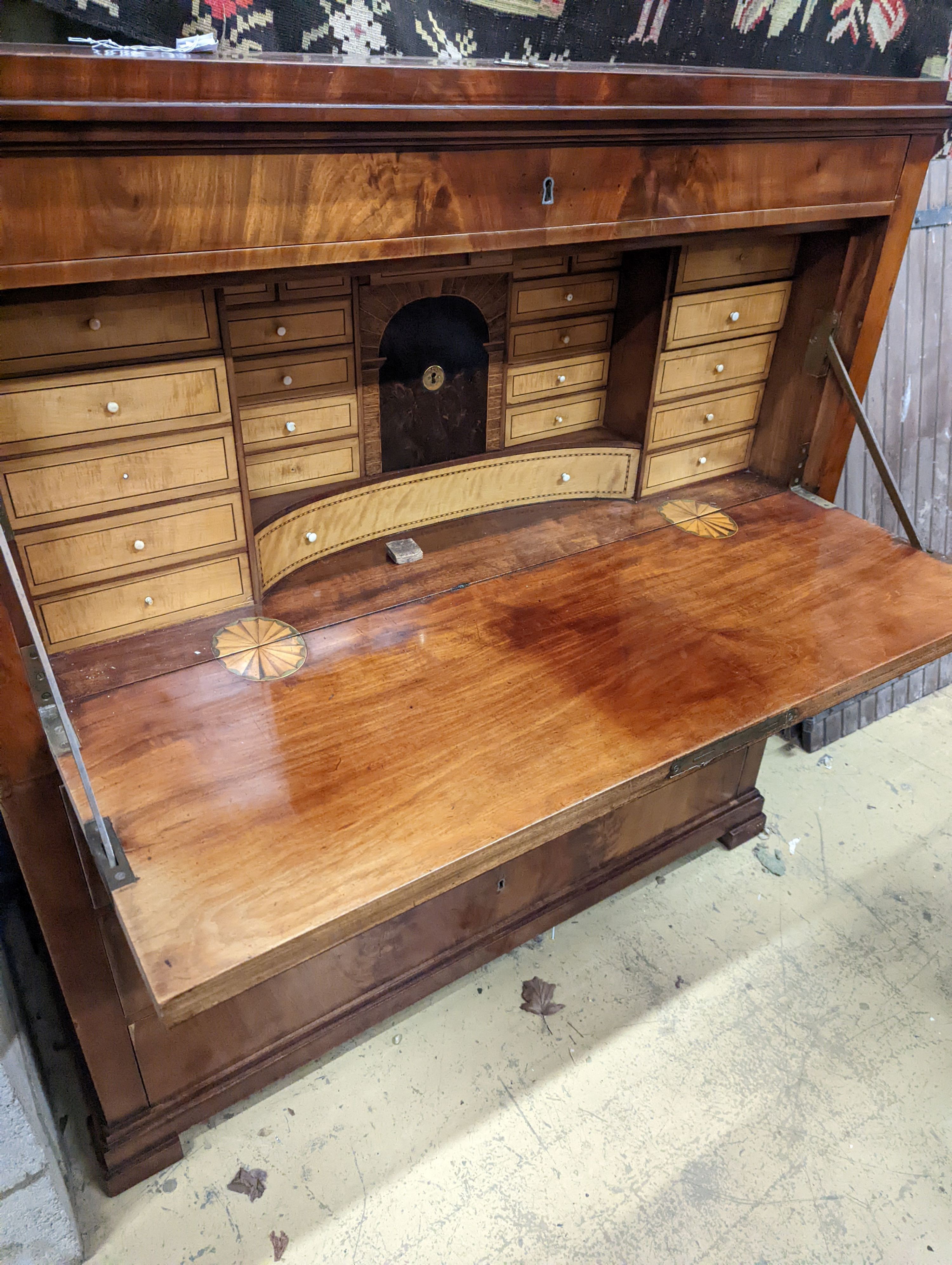 An early 19th century Danish flame mahogany secretaire a abbatant, with birchwood fitted interior, length 127cm, depth 56cm, height 130cm